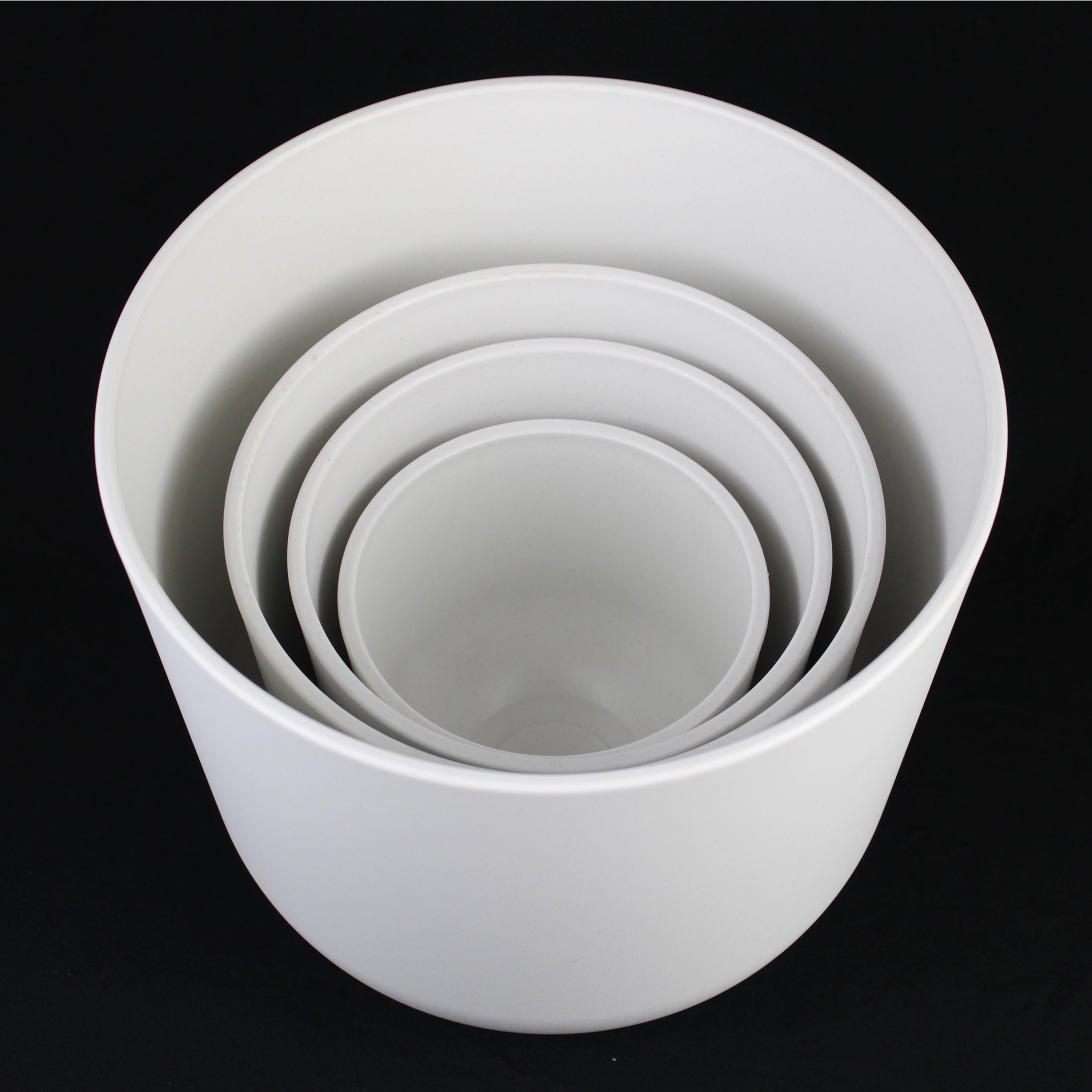 4-Piece White Round Plastic Planter Set