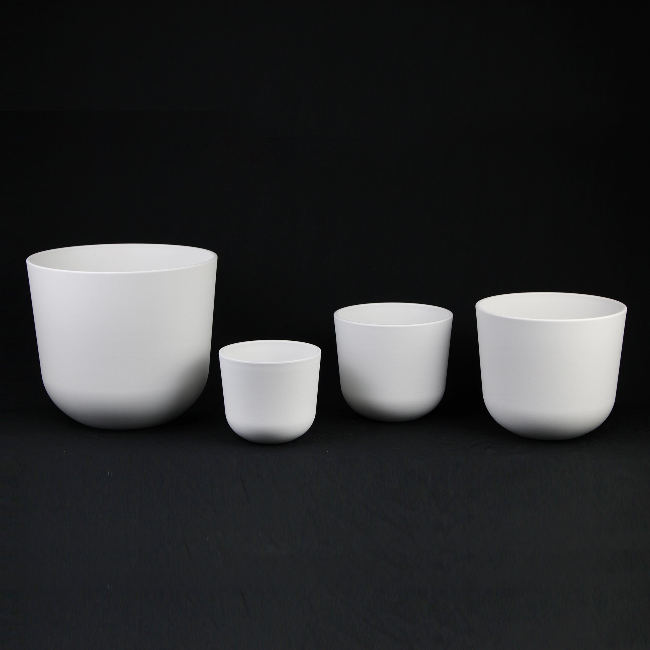 4-Piece White Round Plastic Planter Set